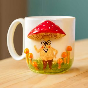Home handmade ceramic mug with mushroom design